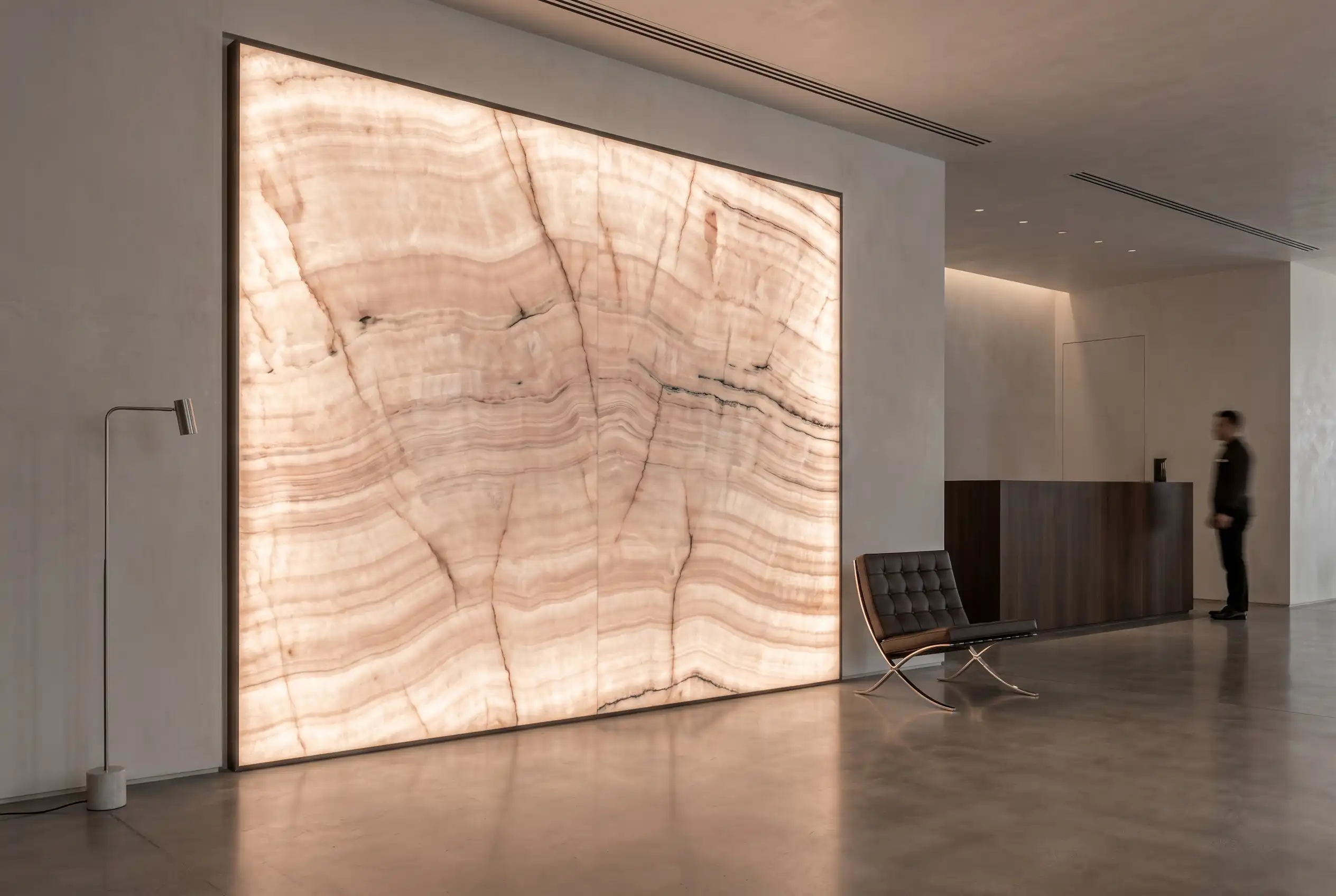 Backlit pink onyx architectural panel revealing natural banding and vein variation - 1 Backlit pink onyx architectural panel revealing natural banding and vein variation