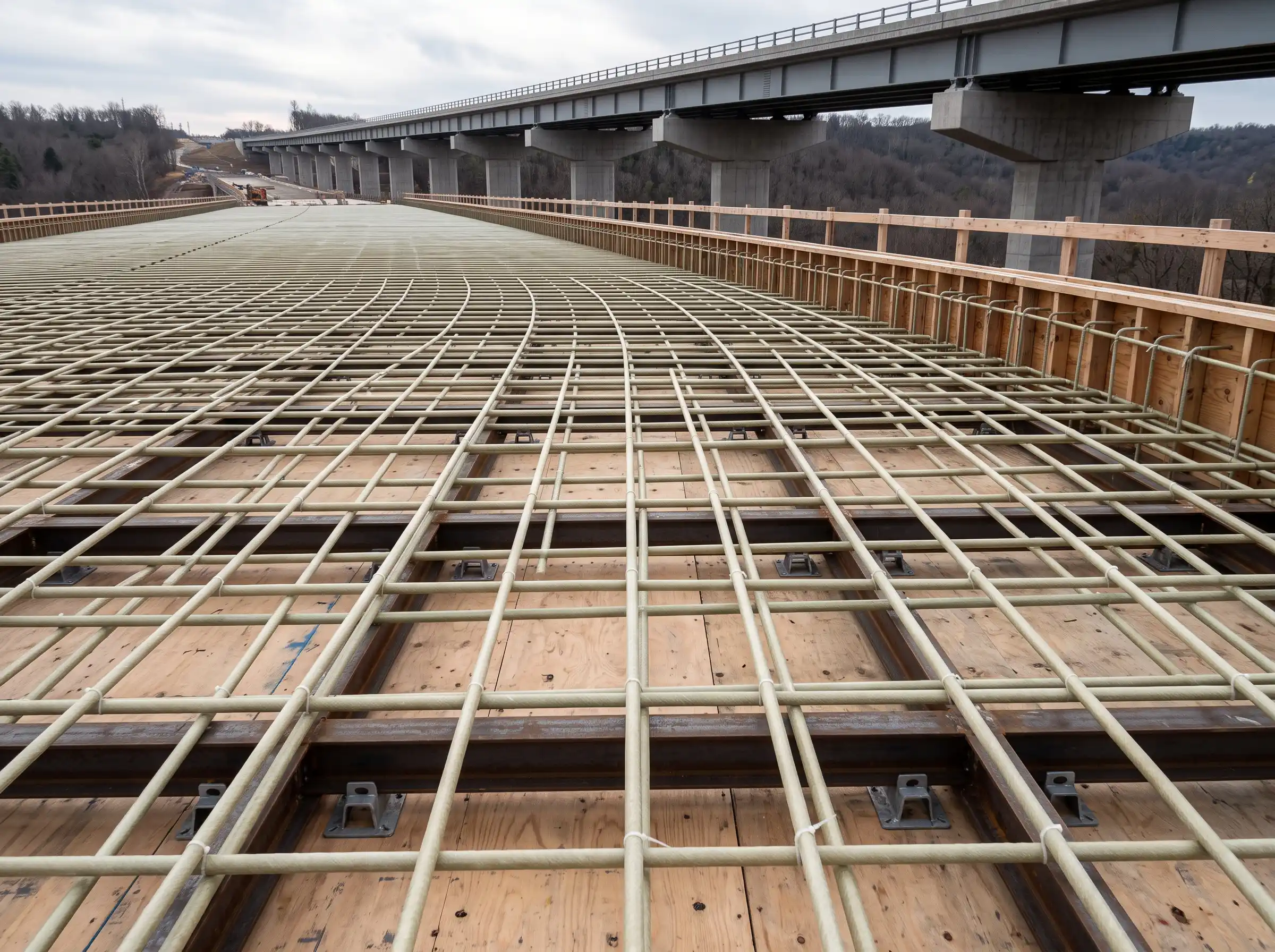 GFRP reinforcement grid installed in a concrete bridge deck before concrete placement, representing a documented transportation application GFRP reinforcement grid installed in a concrete bridge deck before concrete placement, representing a documented transportation application